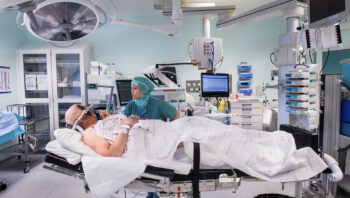 How do operating theatres prevent hypothermia?