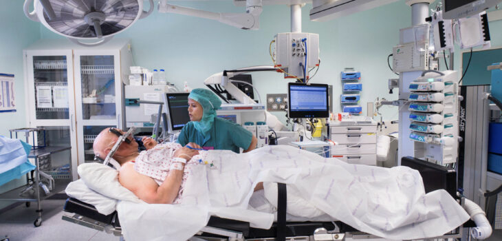 How do operating theatres prevent hypothermia?